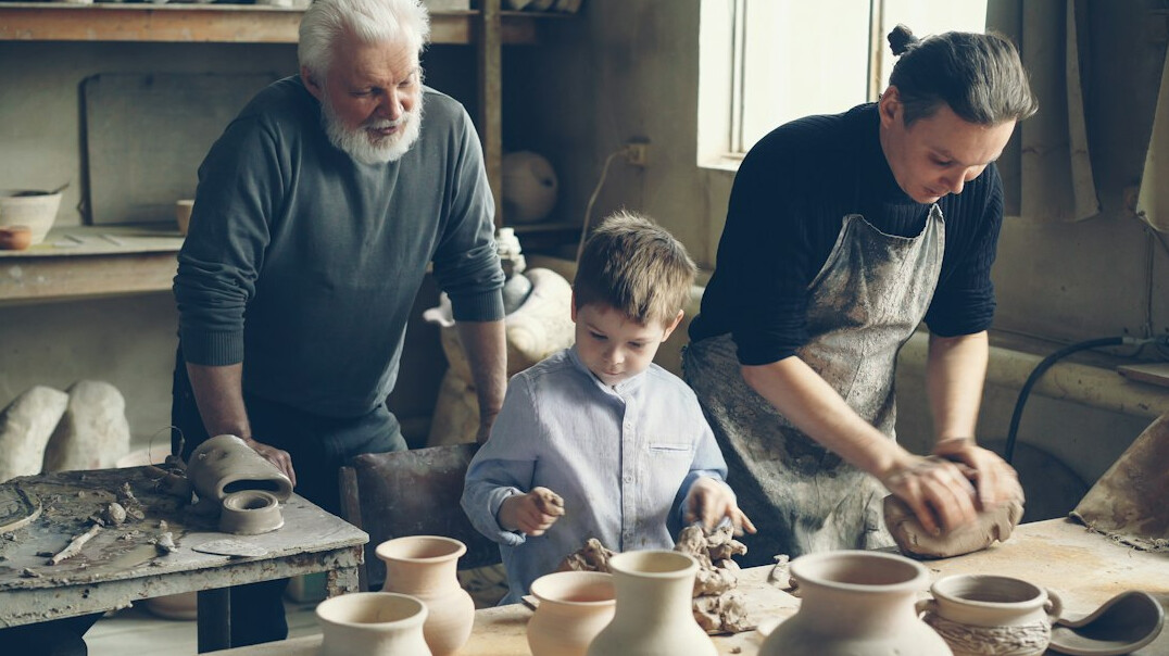 Group of professionals in a workshop seated around a table